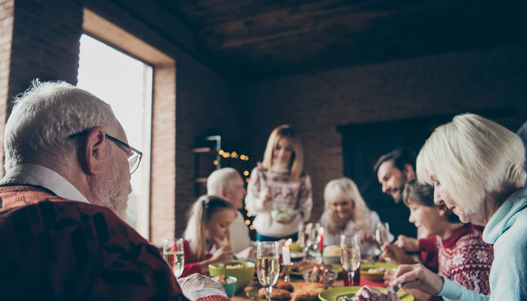 Noel evening family gathering, meeting. Grey-haired grandparents, grandchildren, daughter, son, brother, sister, relatives sitti