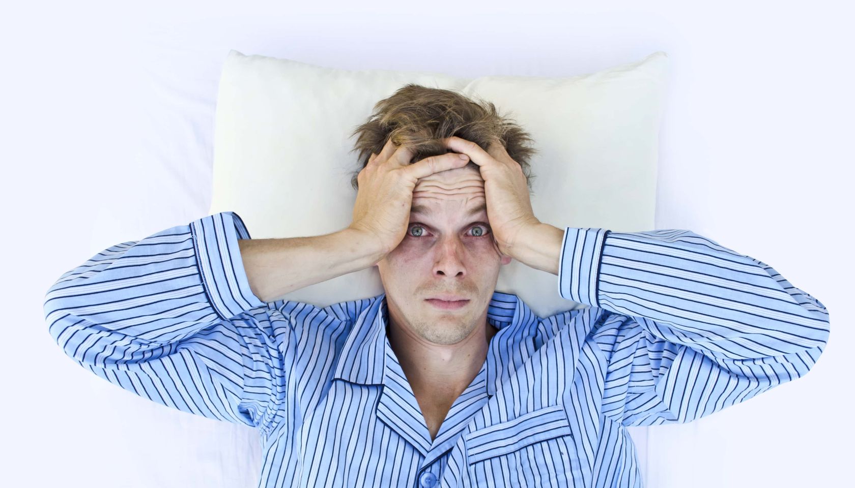 A man not able to get to sleep because of stress