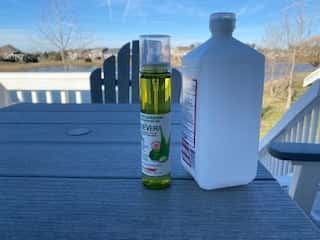 bottle of rubbing alcohol and a bottle of aloe vera
