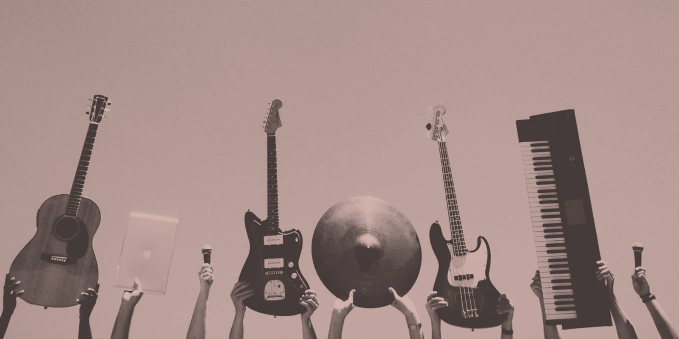 pink instruments, guitars, microphone, and piano held in the air