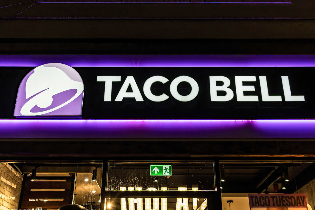 A logo of Taco Bell is seen on the exterior of its store in...