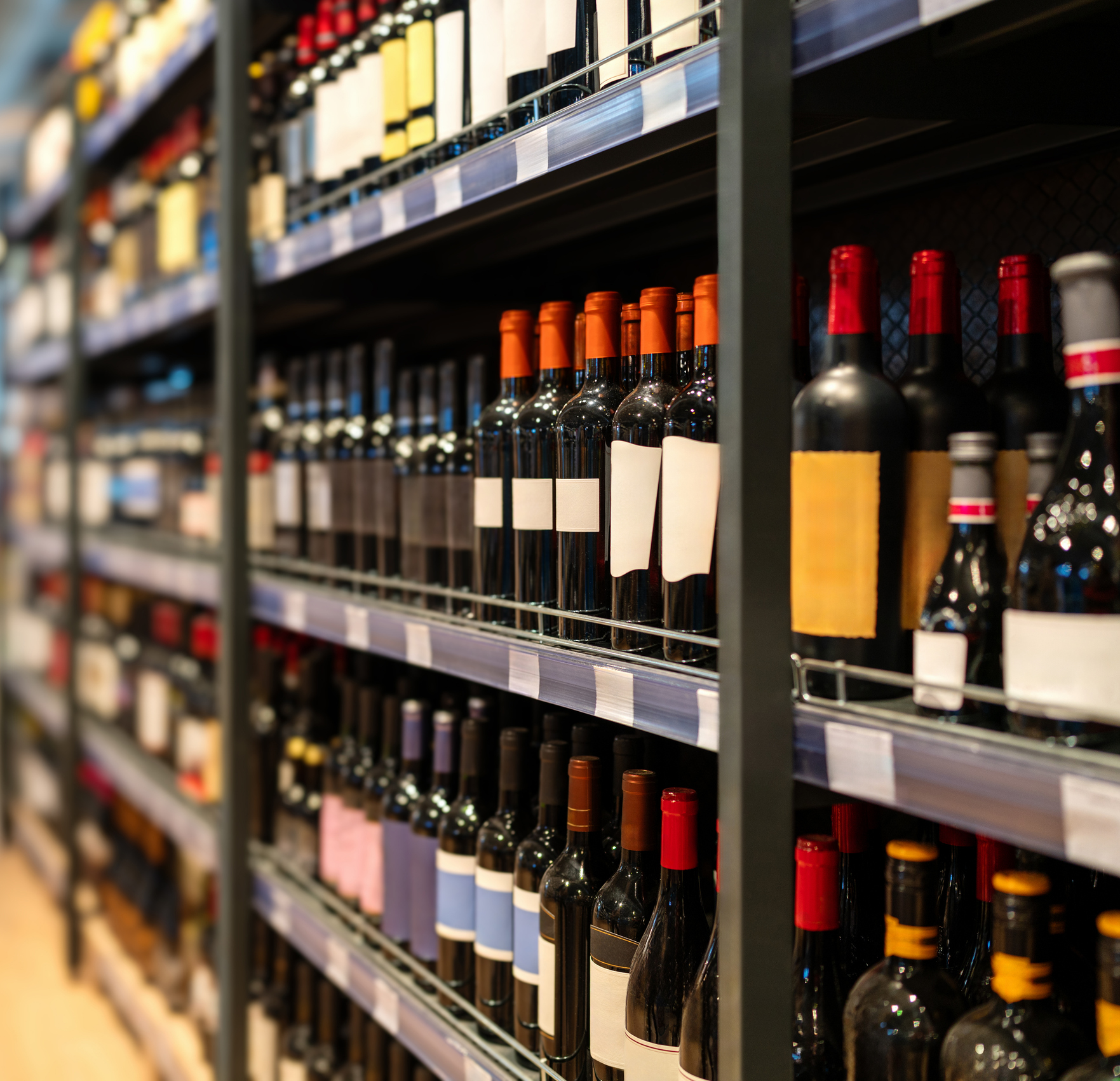 Wine bottles on shelves in the wine shop.
