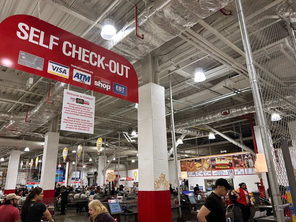 Customers using Self Checkout machines at Costco Store, Queens, New York