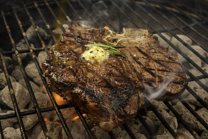 T-Bone Steak on Grill with Flames