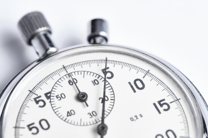 Mechanical stopwatch white background closeup.