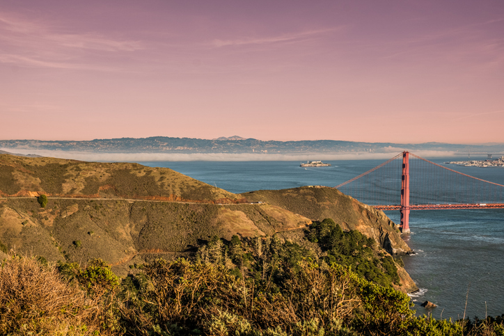 The golden gate bridge with the Alcatraz Island Prison in the background in San Francisco California USA