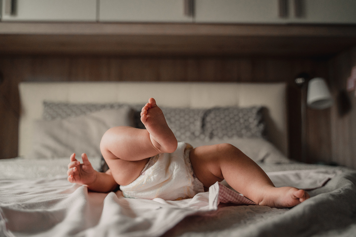 Baby Relaxing on Bed with Playful Movements