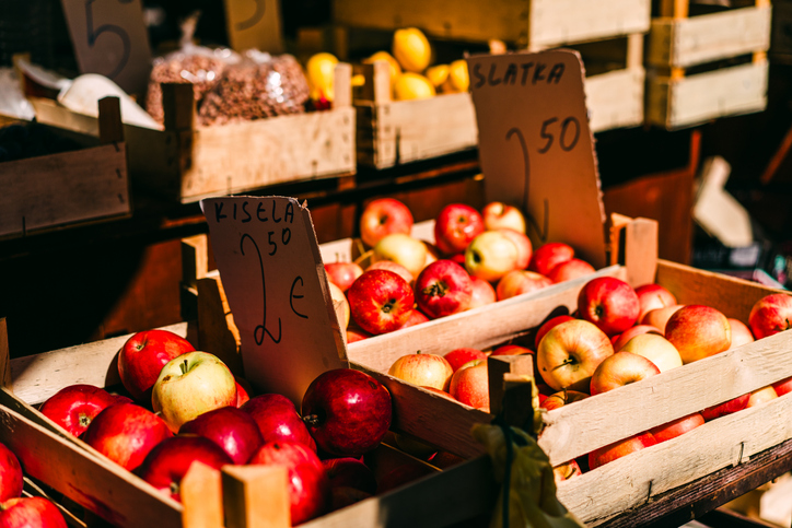 Local Market with Crates of Apples for Sale in Natural Light