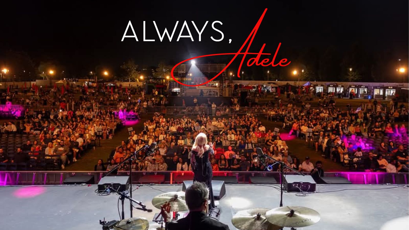 A large crowd at a nighttime outdoor concert, with the text "ALWAYS, Adele" prominently displayed on stage.